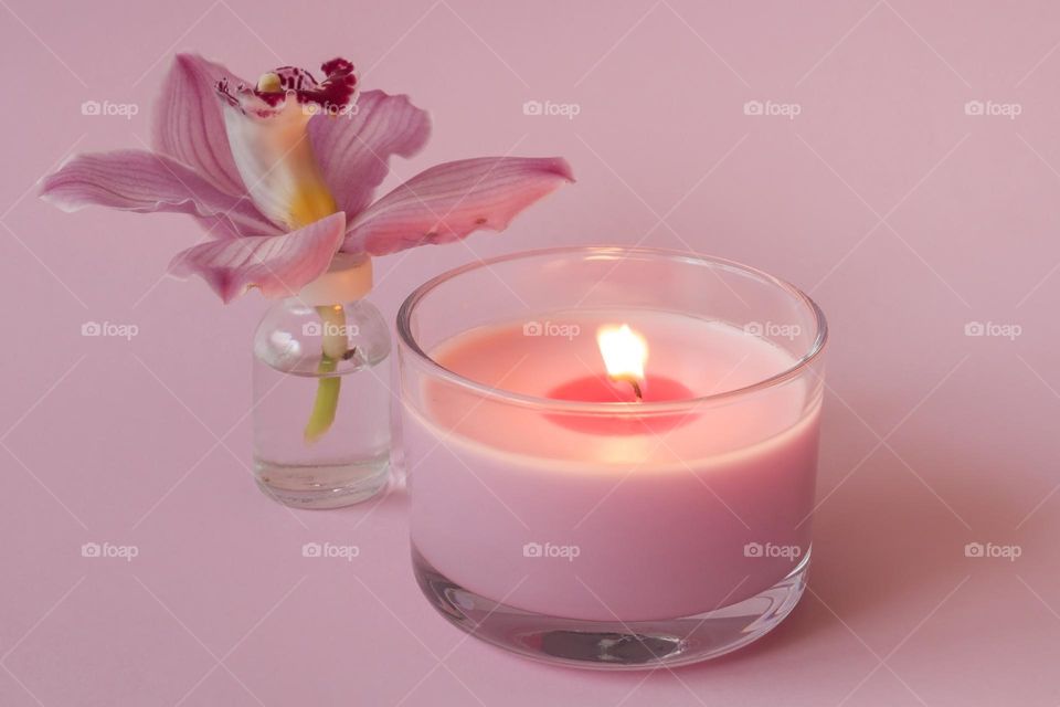 Pink orchid flower and candle