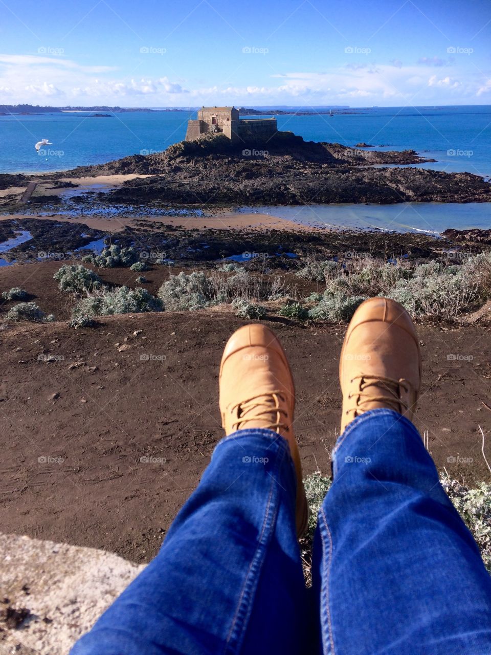 Sunny beach in France. These boots were made for walking. Resting my poor feet after a good walk around. 