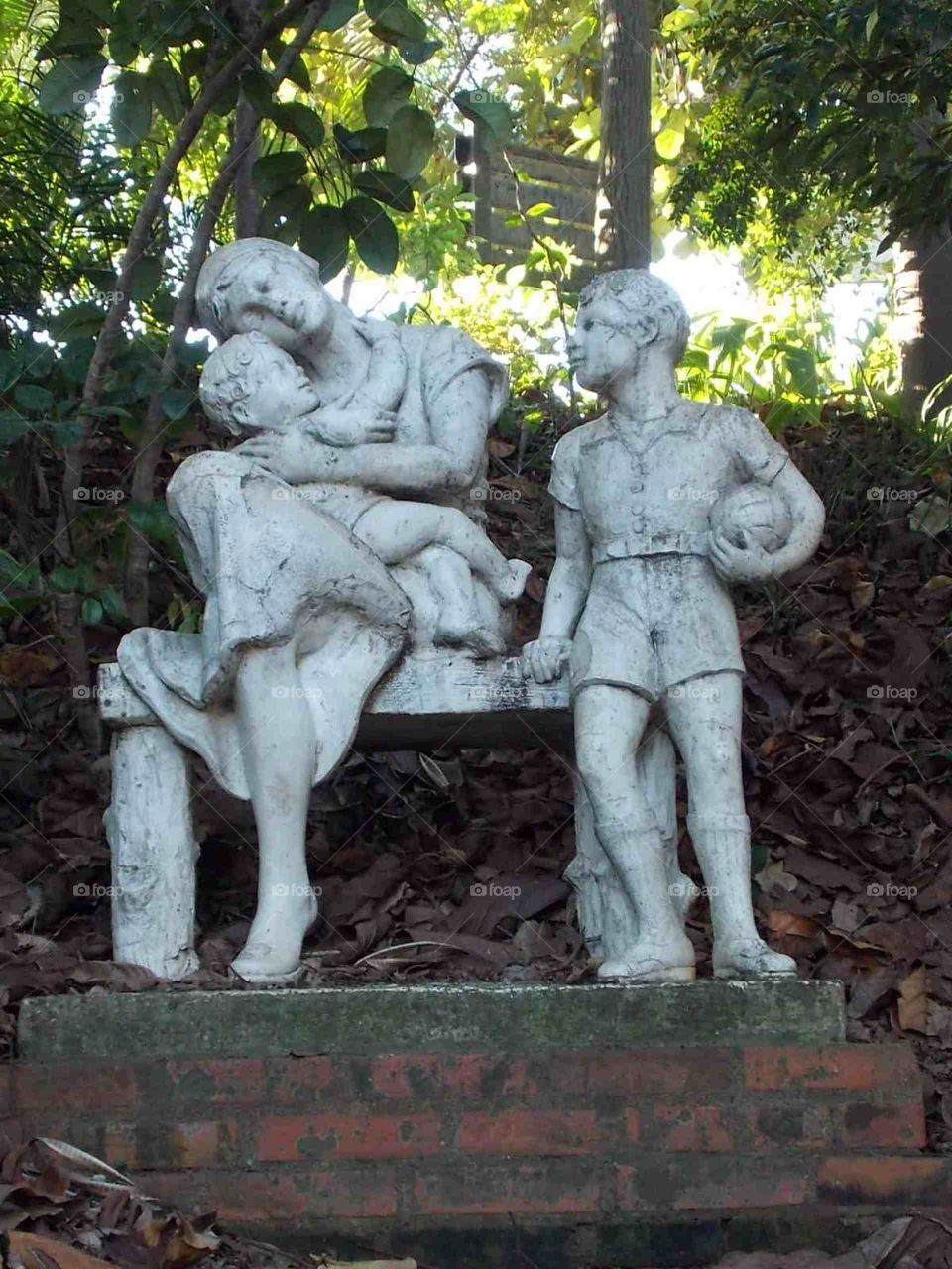 Statue holding her son.