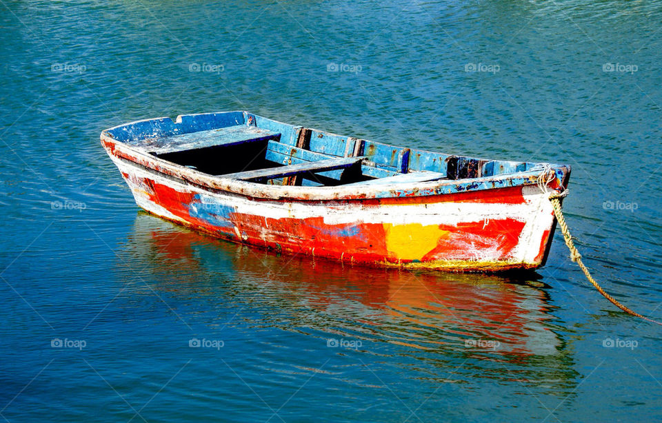 Little colorful wood boat used in Yucatan peninsula for fishing