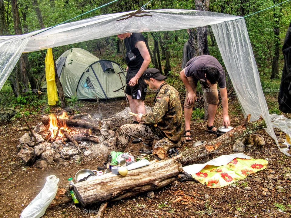 men rest after a hike