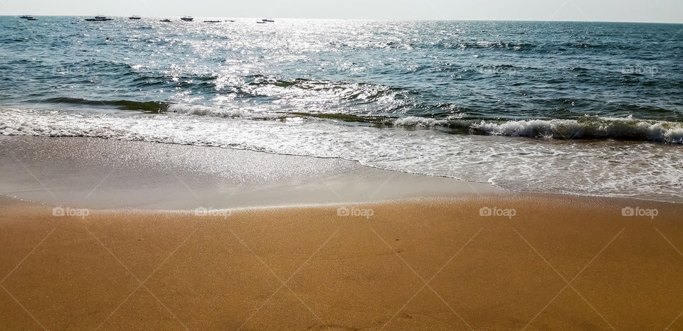 Beach or seashore -Beauty of Beach with blue sea water and small sand.