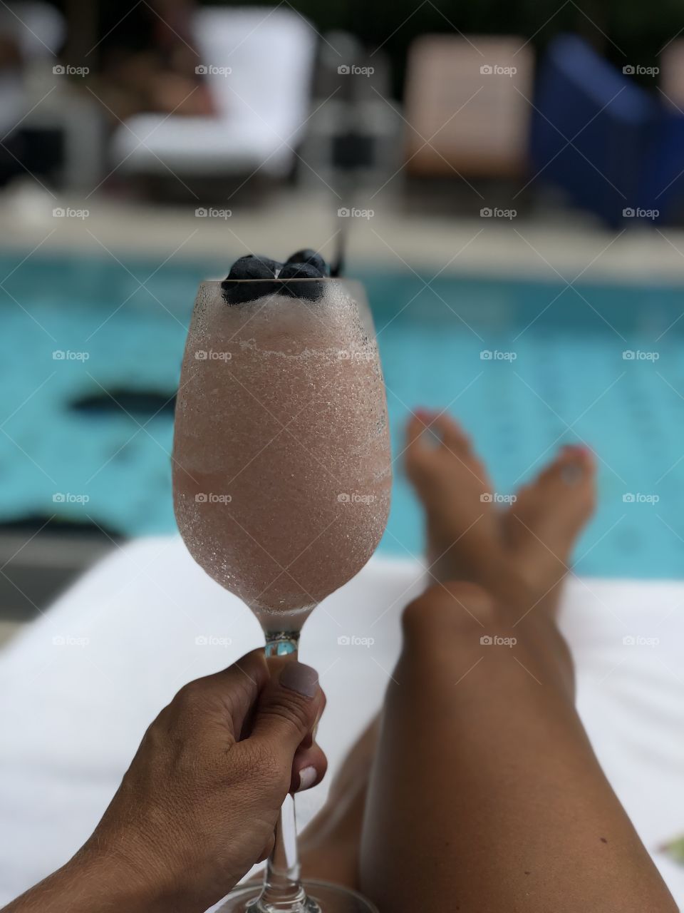 Summertime rooftop cocktail by the pool in New York