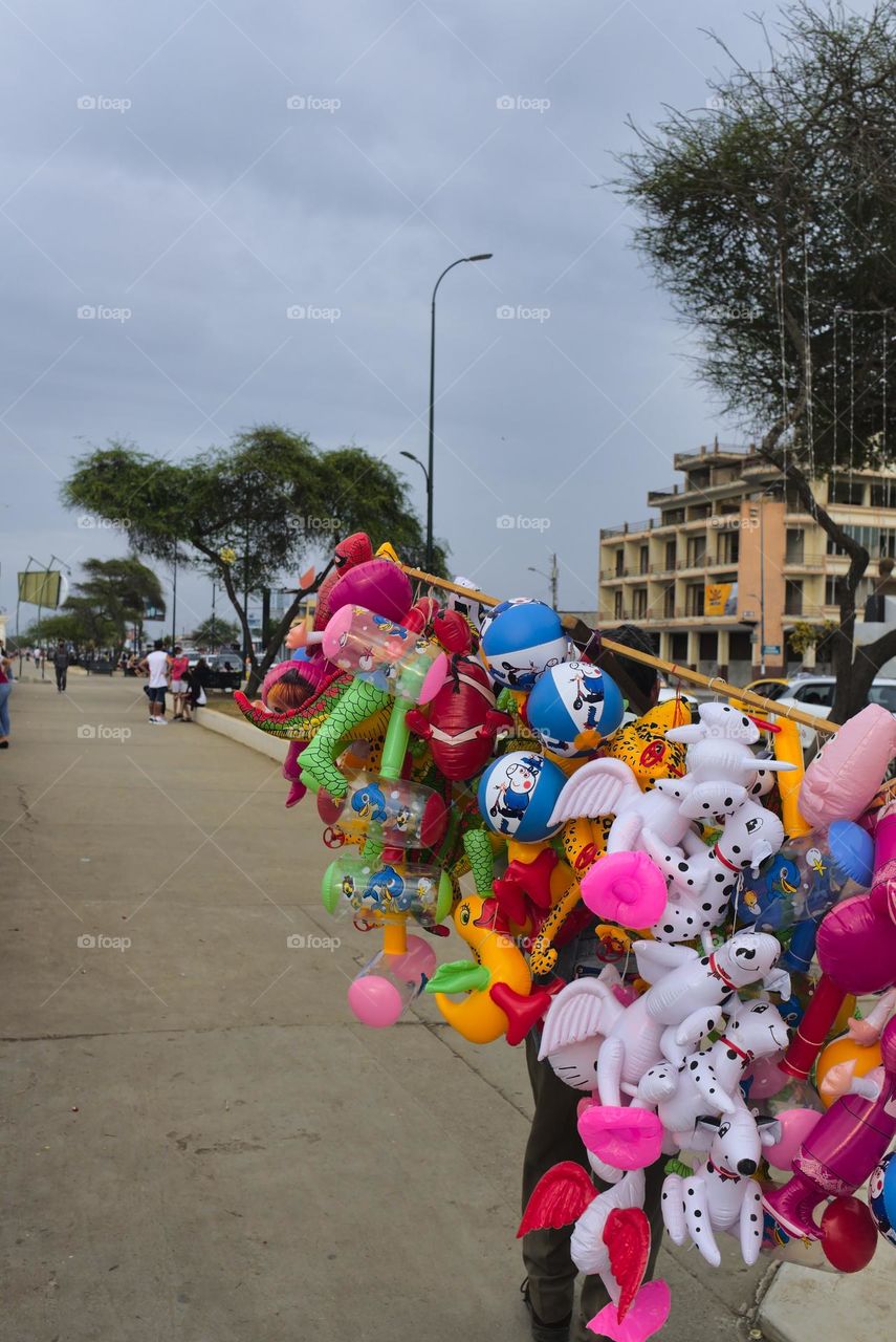 Pink balloons for sale on street