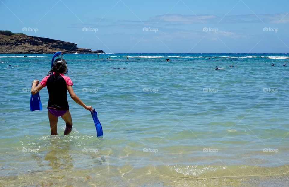 Summer travel, girl with snorkel and fins
