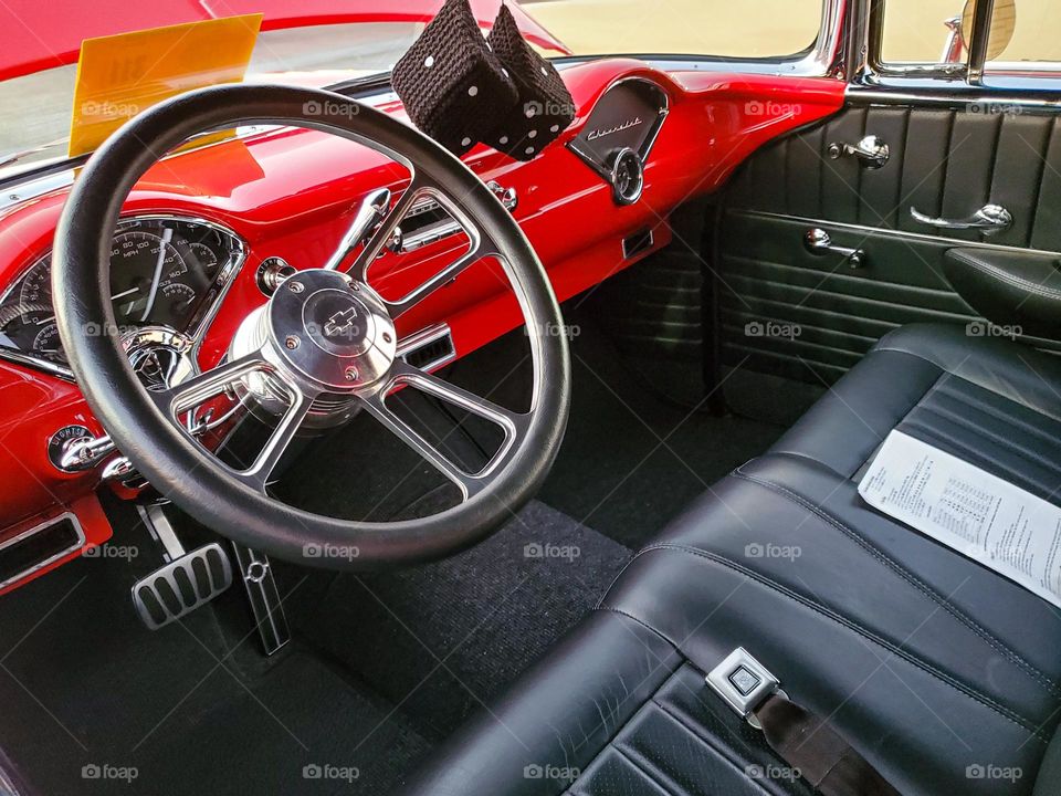 A classic 1950's Chevy hot rod complete with fuzzy dice