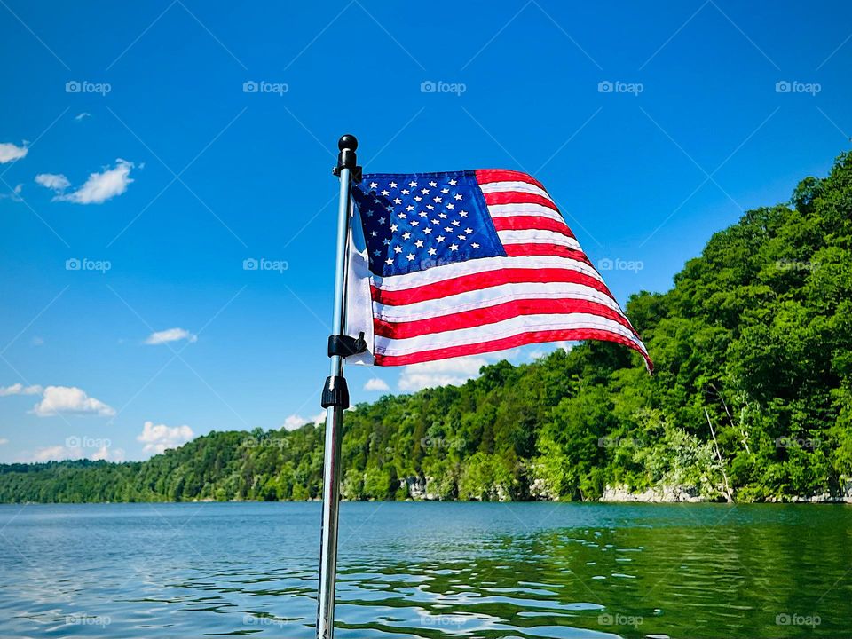 The United States of America flag flying from a boat on Lake Cumberland in Kentucky 