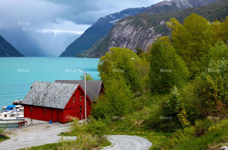 Red house in the fjord. 