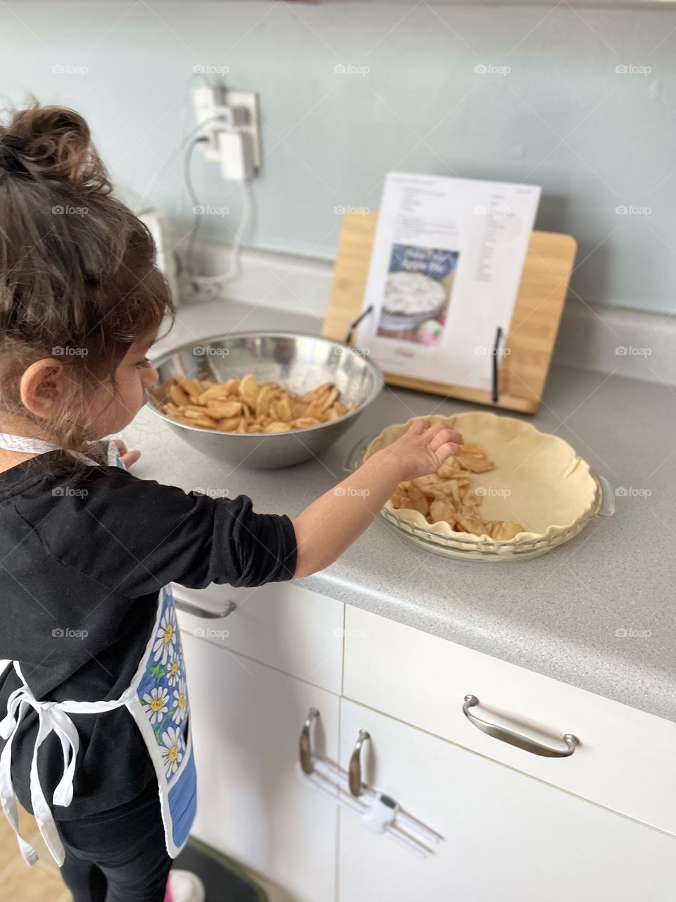 Toddler girl helps to make pie, toddler helps mommy bake, making apple pie with Mommy, toddlers in the kitchen, baking pie with Mommy