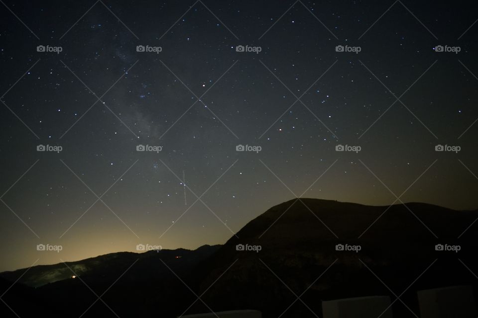 stars shining with mountain silhouette