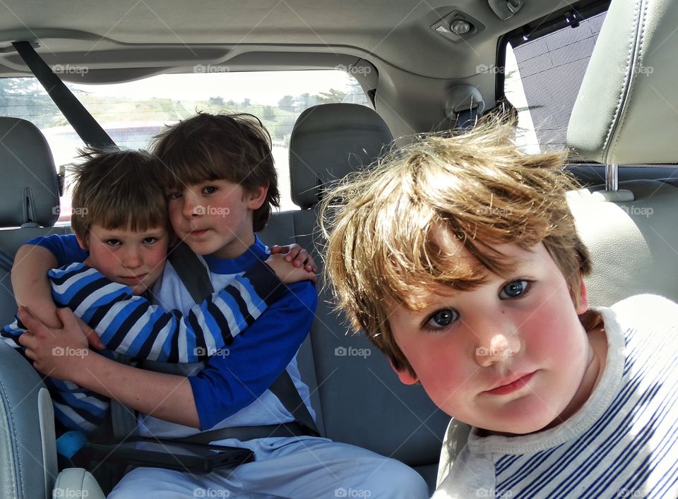 Three Brothers. Three Young Brothers Riding In A Minivan
