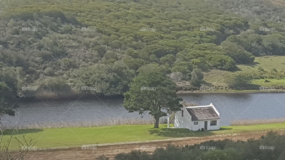 small house next to river in stilbaai south africa