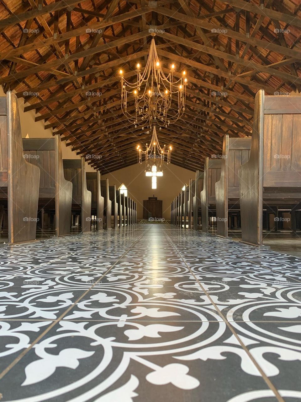 Chapel: Moroccan chapel. Church. Wedding venue. Pews. Moroccan tiles. Chandeliers. Cross. Wood. 