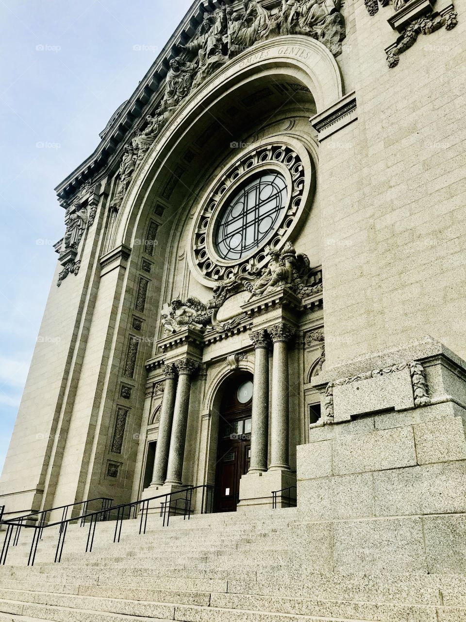 Gorgeous tan colored catholic cathedral on corner full of beautiful stain glasses windows! 