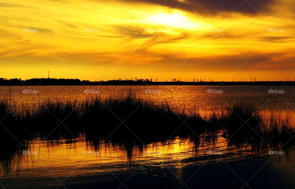 Idyllic lake against dramatic sky