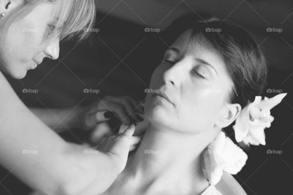 bridal make up. woman getting make up for her wedding day