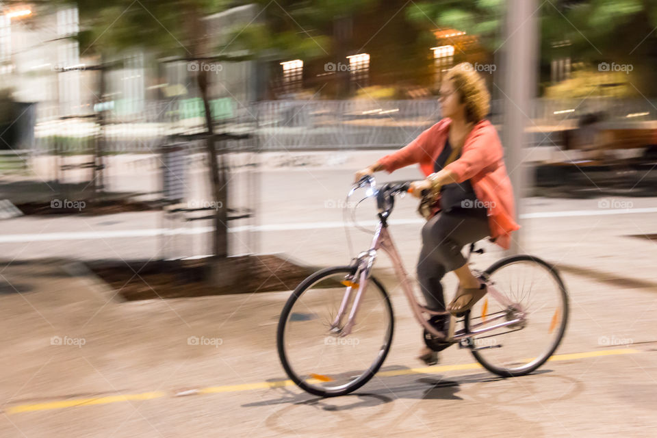 Middle Aged Woman On Bike Ride In The City
