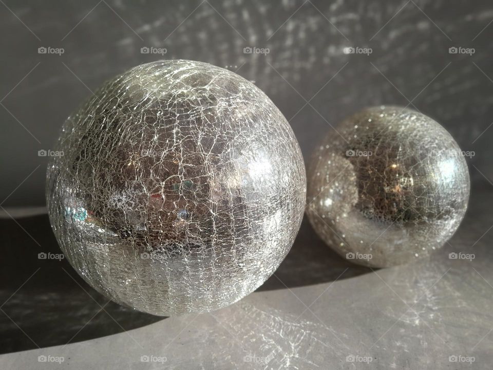 shattered and shiny, bright and full of light, spreading across the room and into the eyes of beauty.