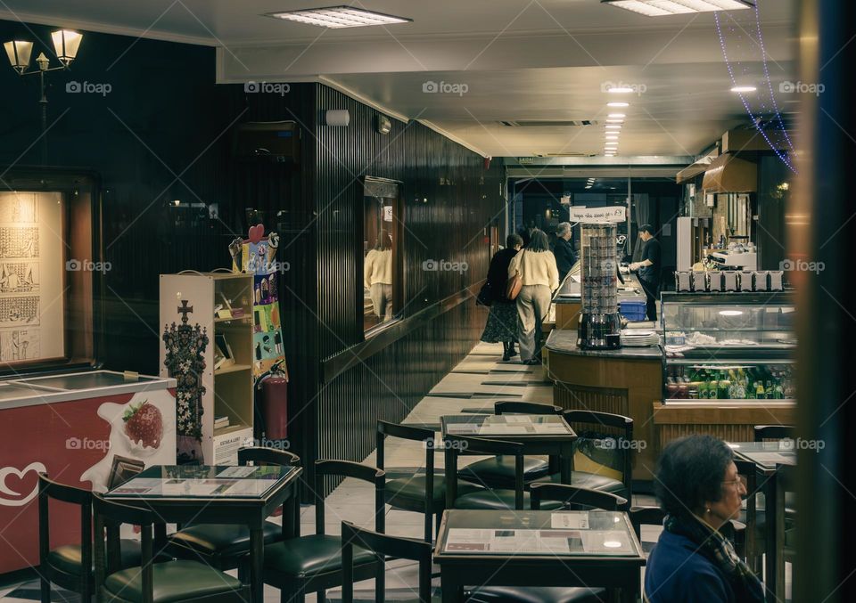 Evening business through the window of a cafe