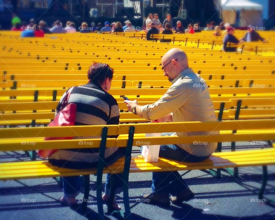Taking a break . Sea of yellow benches to sit and rest at the state fair - yellow mission 