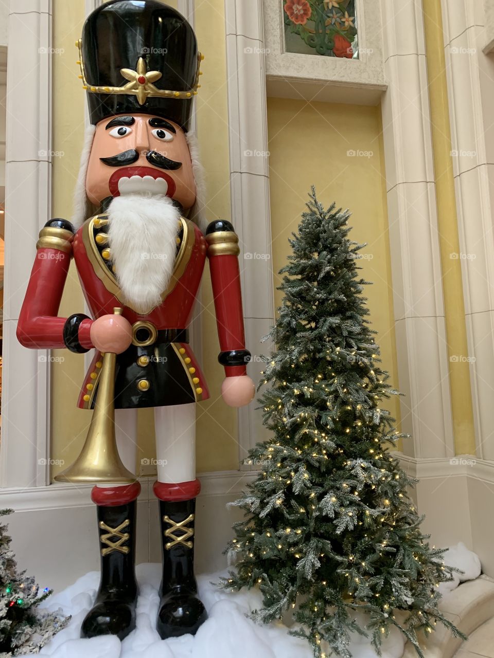 Decorating for Christmas. Large colorful decorations. The traditional colors of Christmas are pine green (evergreen), snow white, and heart red. Blue and white are often used to represent winter