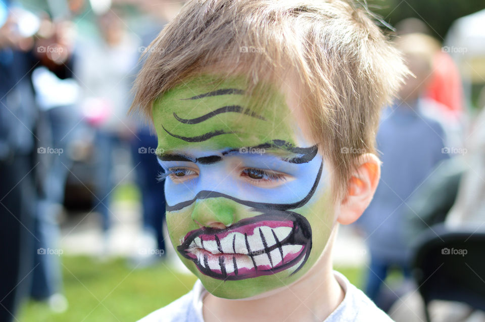 Young boy's face painted for Halloween