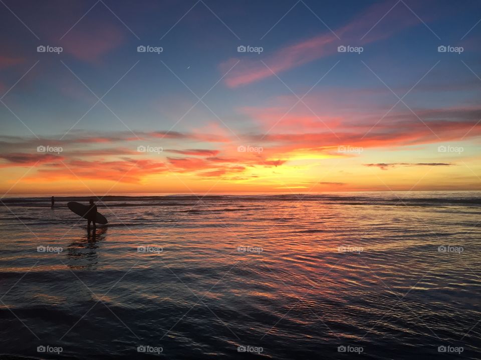 Sunset surfer silhouette from Cardiff Beach Near San Diego California