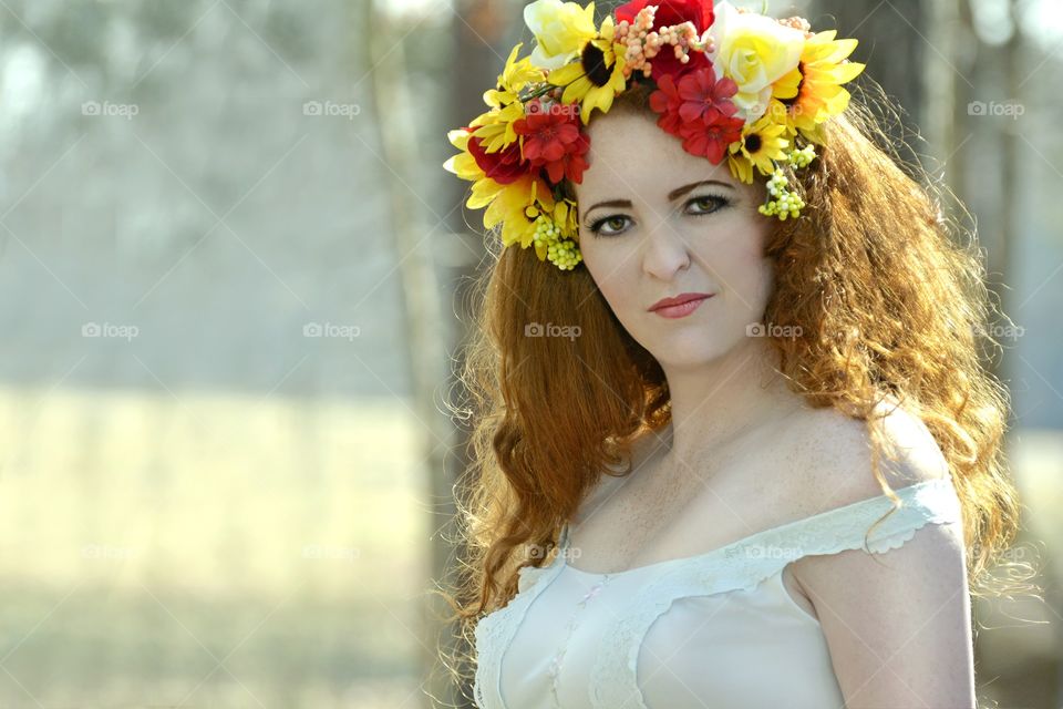 Portrait of a woman wearing flower wreath
