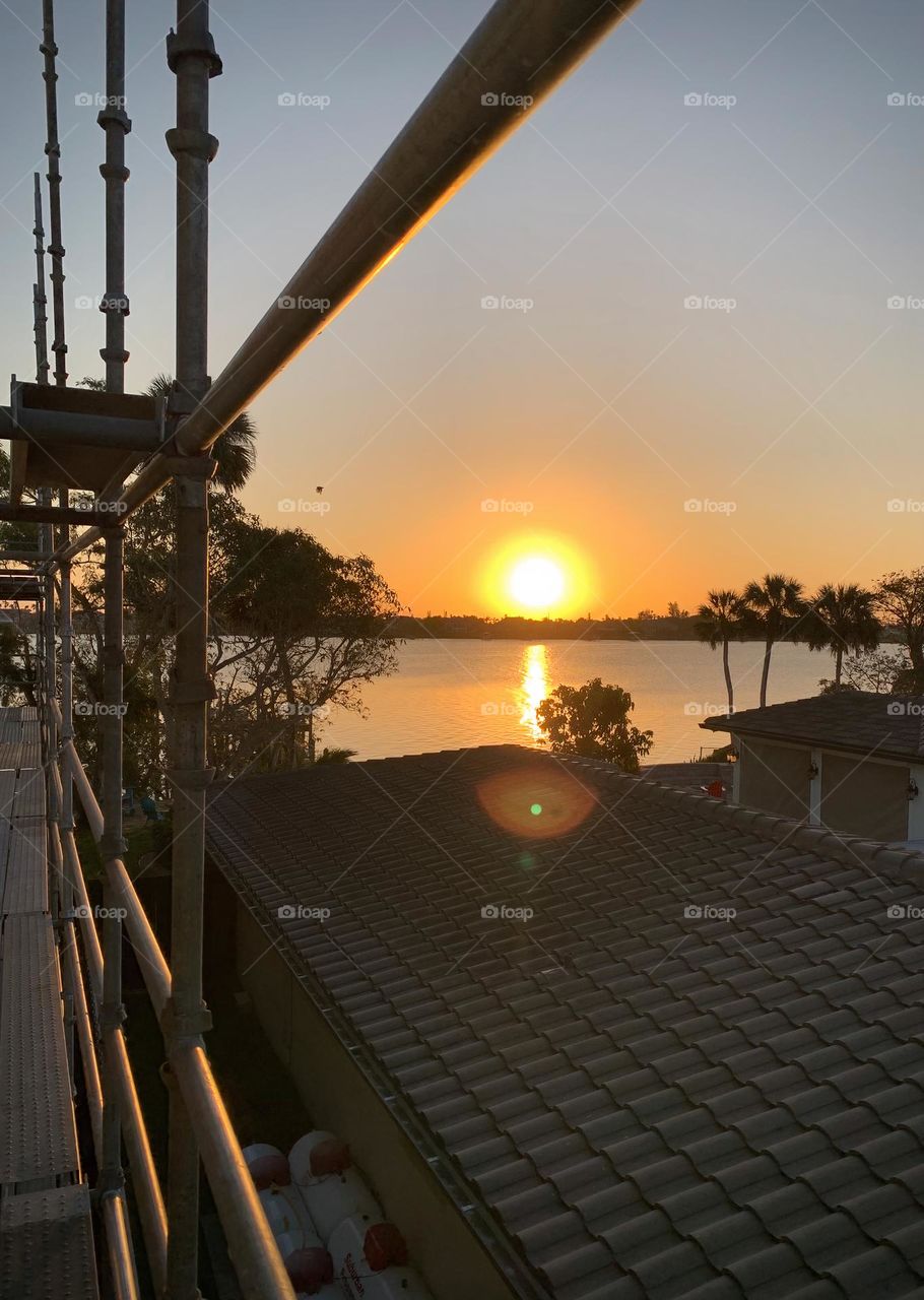 Beautiful Sunrise View From A Roof On The Atlantic Ocean With While Building Scaffolds.