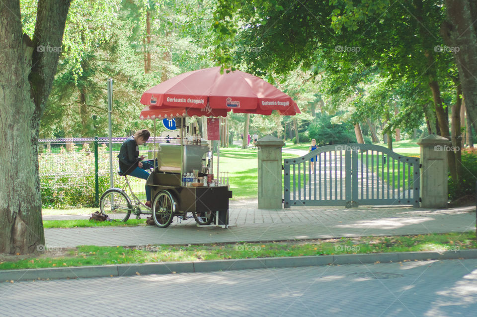 Coffee machine with bicycle near the park 