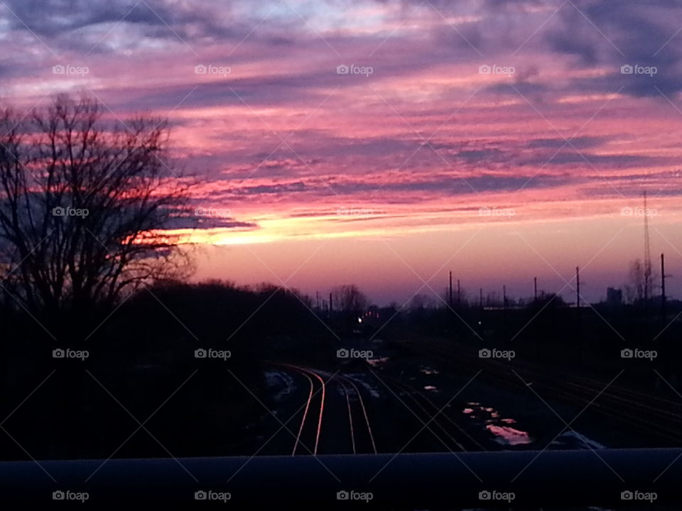 sunset on the railroad tracks