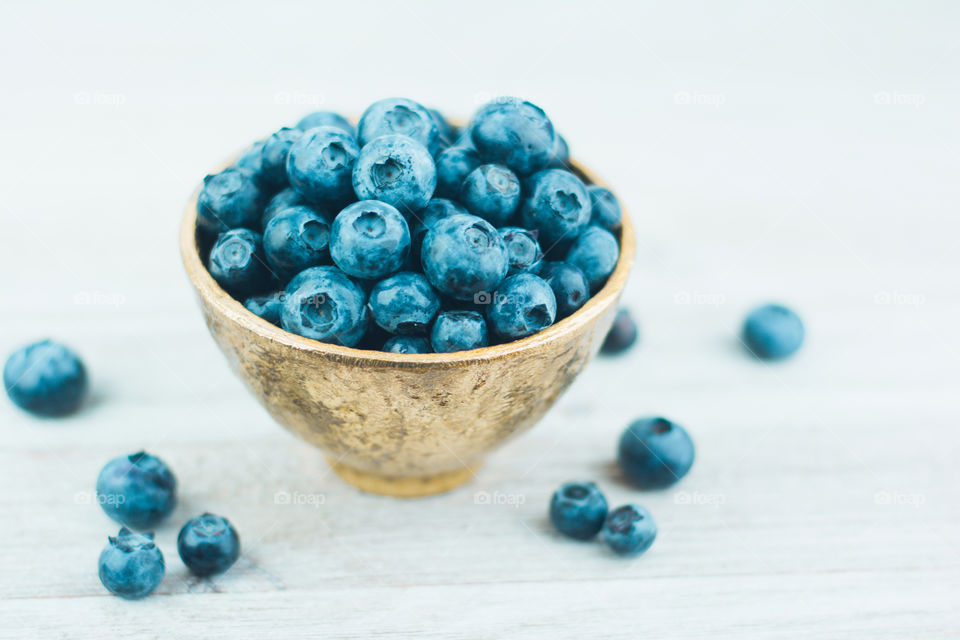 Fresh Blueberries in a Gold Bowl on a White Table 2