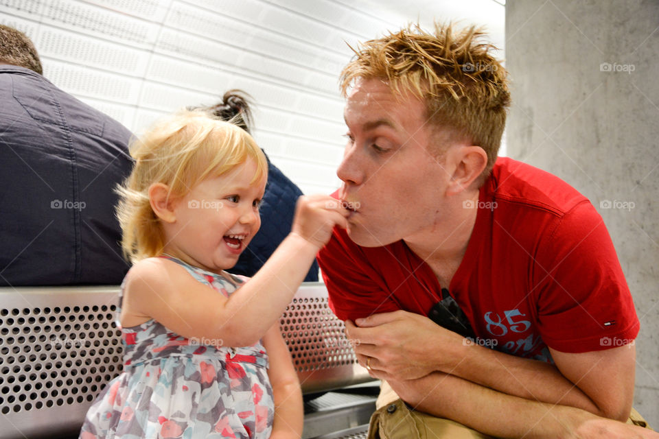 Dad playing with his doughter of Two years old.