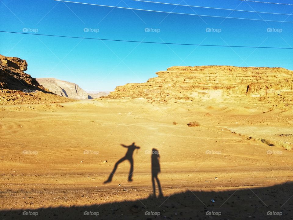 Shadows jumping in the desert