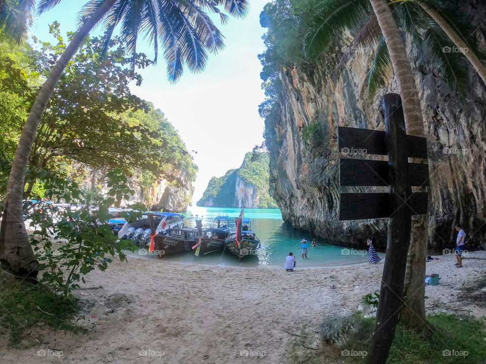 Thailand beach landscape with greenery and boats with a variety of spectacular colors