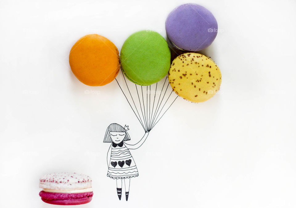 My illustration drawing of a girl holding balloons of real macaroons desserts