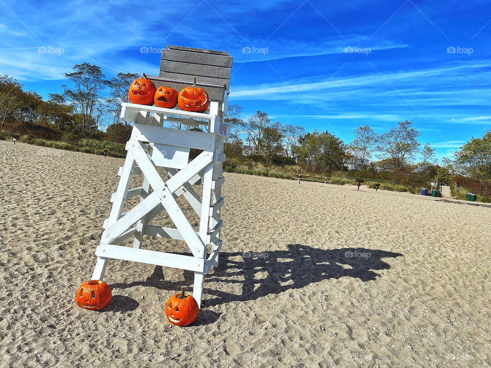 Jack O’lanterns at the lifeguard station at the beach 