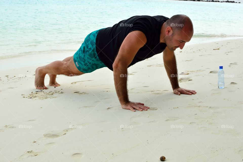 push-ups to keep fit on the beach