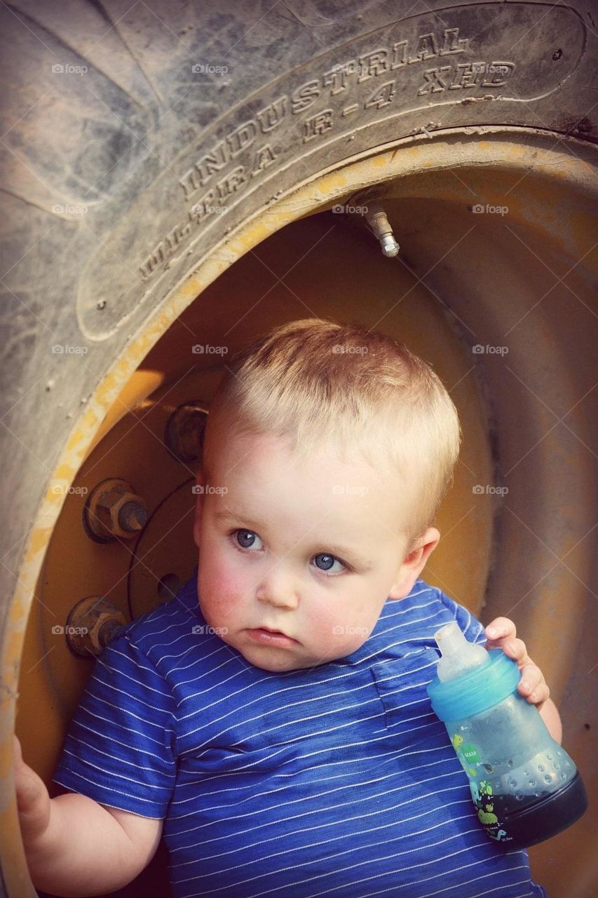 Baby setting in dozer tire