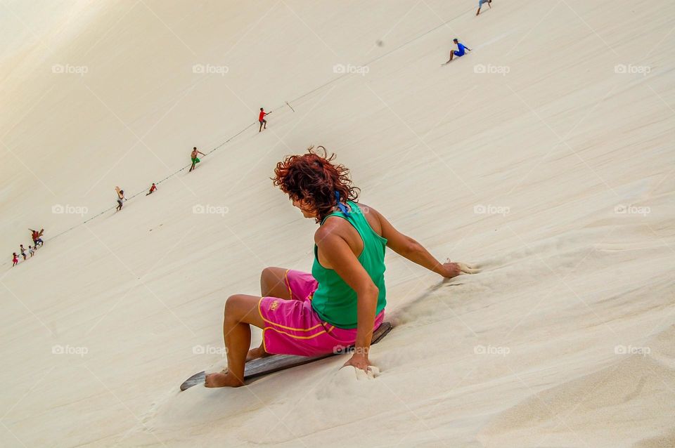 Woman godown on dunes 