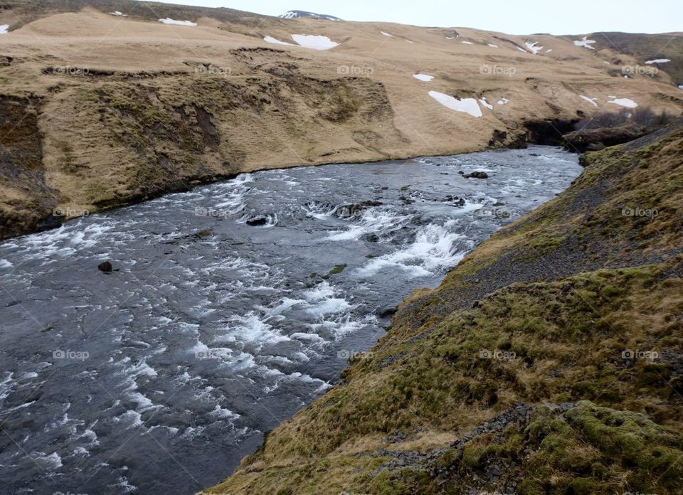 Stream in Iceland at top of waterfall