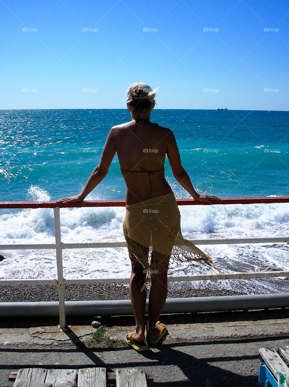 A Girl watching waves come 