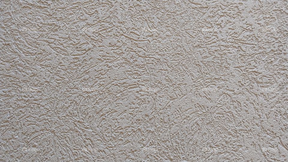 Textura de grafiato em parede. trabalhos em pintura residencial. Fundo, declaração.