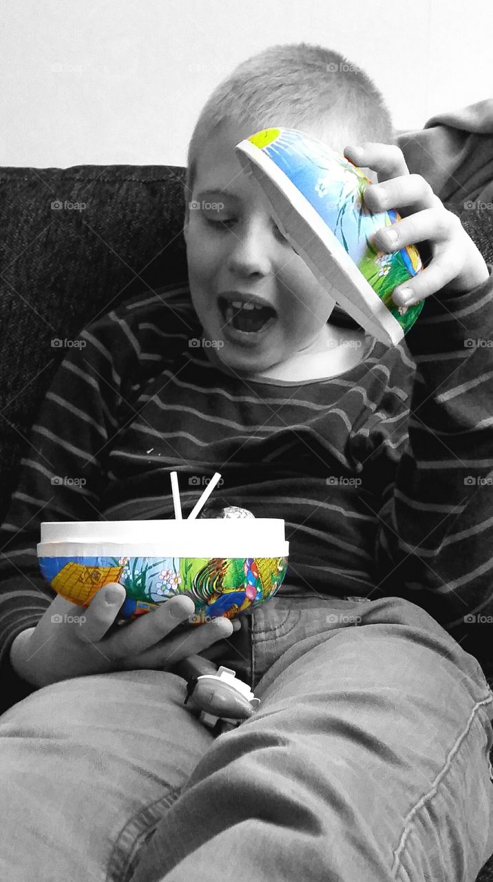 Boy holding food container