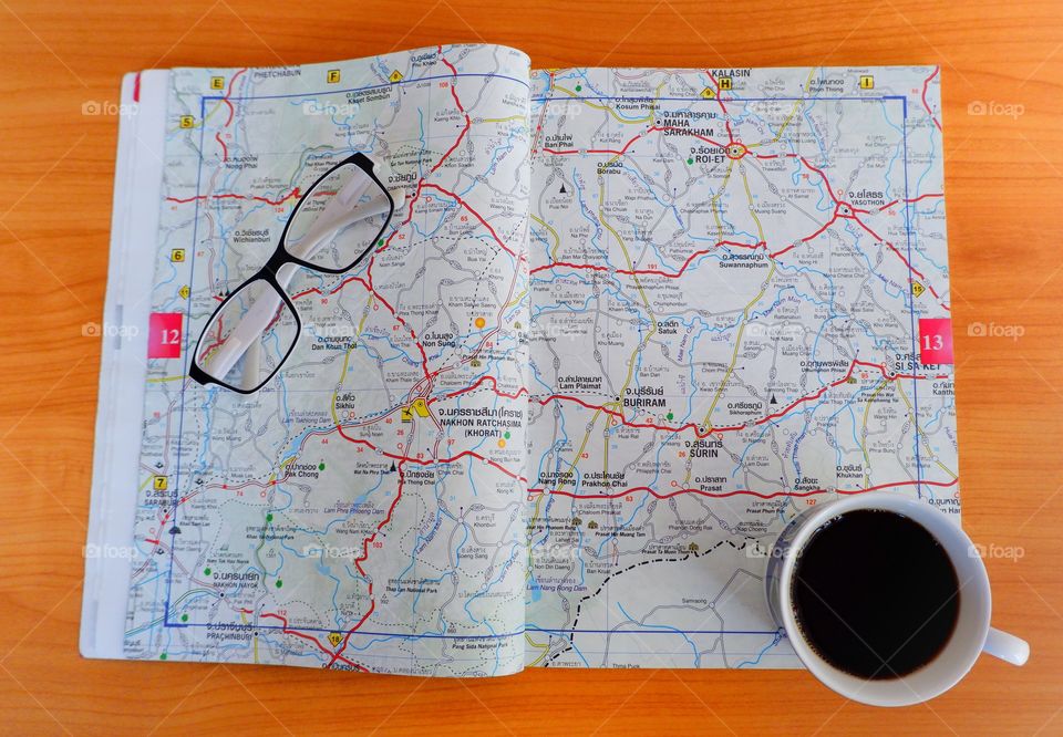 Chill out with coffee and navigator book map.