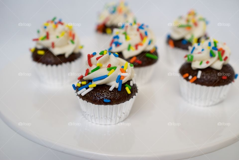 Sprinkled cupcakes on plate