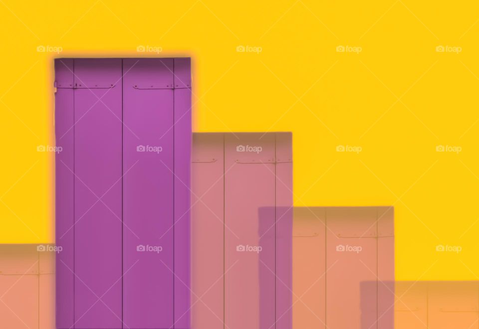 purple door on a yellow wall