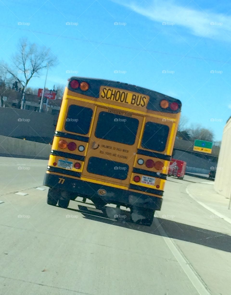 Yellow school bus on road 