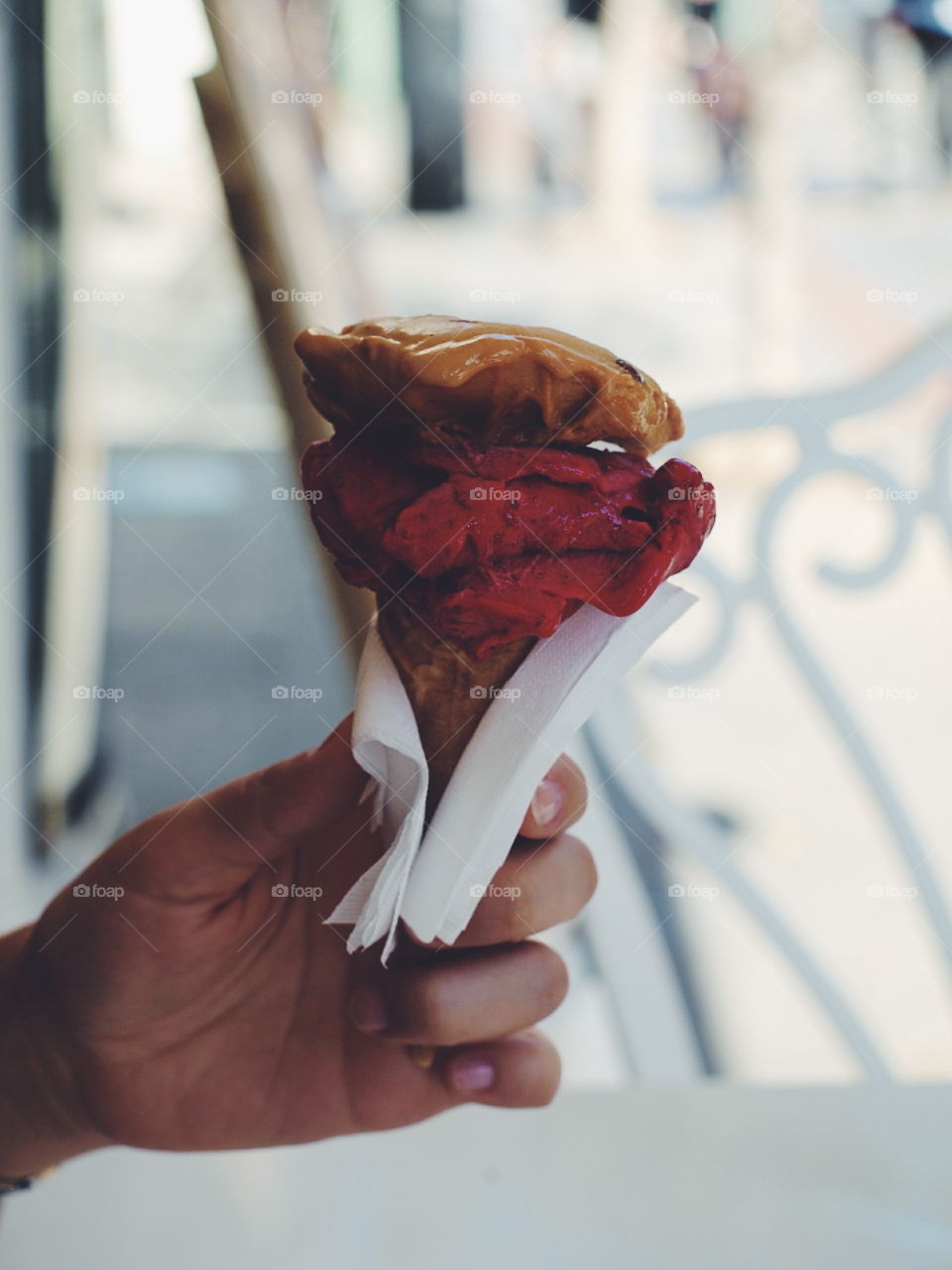 Close-up of person's hand holding ice cream