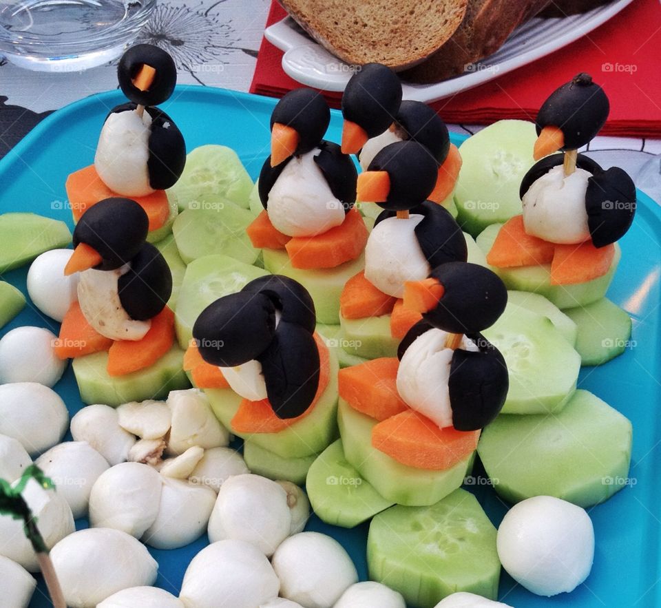 Penguins makes of vegetables. Penguins makes of carrots,olives on cucumbers